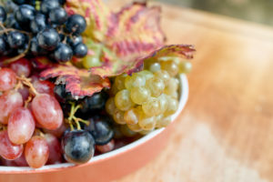 Red, white and light red grapes in a flat bowl Red, white and light red grapes in a flat bowl